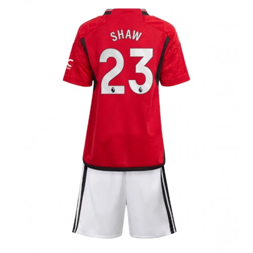 Fotballdrakt Barn Manchester United Luke Shaw #23 Hjemmedraktsett 2023-24 Kortermet (+ Korte bukser)